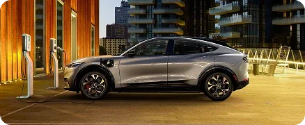 Ford Mustang Mach-E parked at electric vehicle charging stations