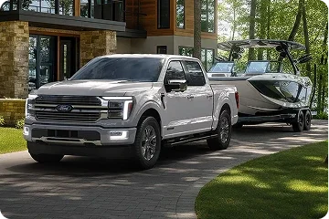 Ford F-150 towing a boat in a residential driveway
