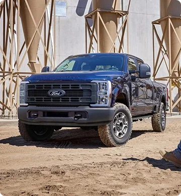 Blue Ford Super Duty parked at a construction site