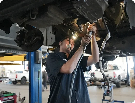 Ford service technician repairing a vehicle with Original Ford Parts